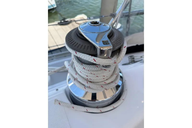 Slide: The Image of Winch with rope on 2015 Catalina 445 sailboat, docked by the water. - 25