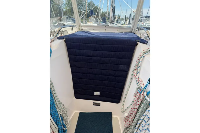 Slide: The Image of Cockpit of 2015 Catalina 445 sailboat with navy cover and colorful ropes. - 15