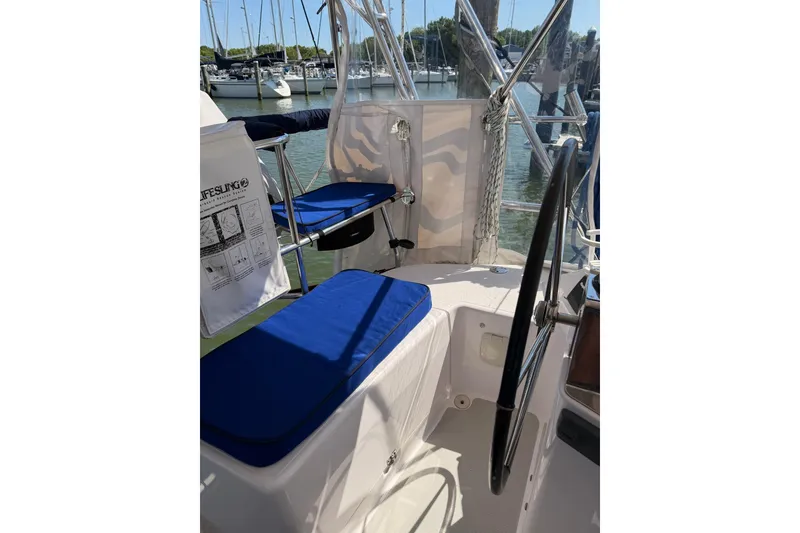 Slide: The Image of Cockpit of 2015 Catalina 445 sailboat with blue cushions and steering wheel. - 20