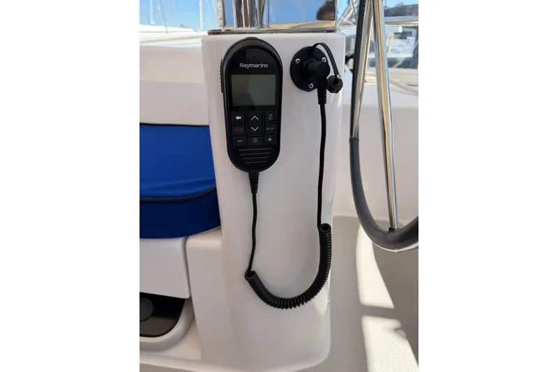 Slide: The Image of Raymarine control panel on a 2015 Catalina 445 sailboat, featuring a coiled cord. - 10