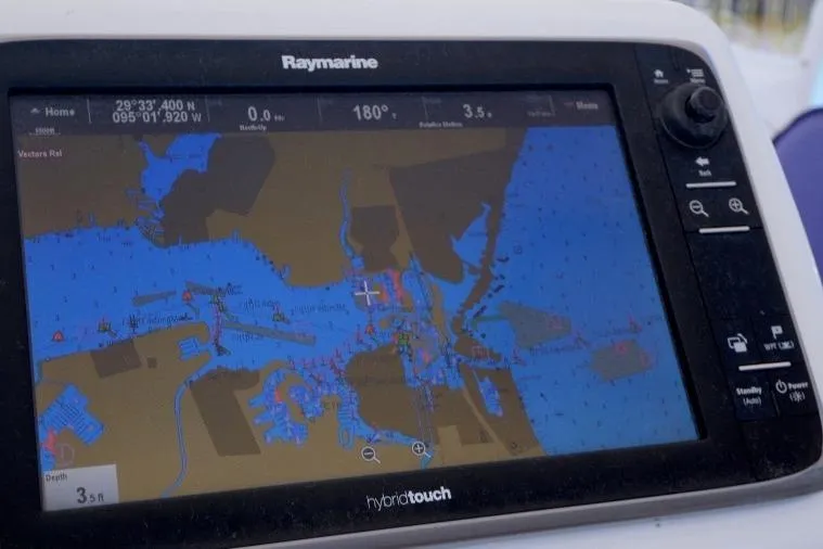 Slide: The Image of Raymarine navigation display on a 2015 Catalina 445 sailboat, showing nautical chart details. - 13