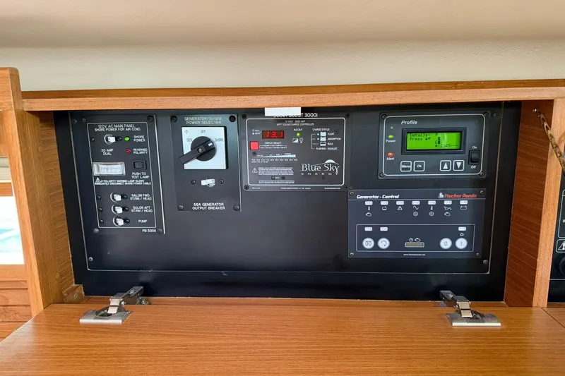 Slide: The Image of Control panel of a 2015 Catalina 445 sailboat, featuring generator and power management systems. - 42