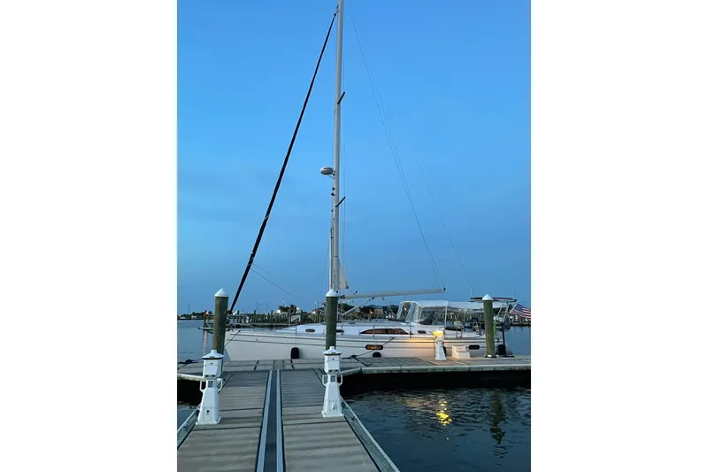 Slide: The Image of Sailboat docked at marina, Catalina 445, 2015 model, during twilight. - 1