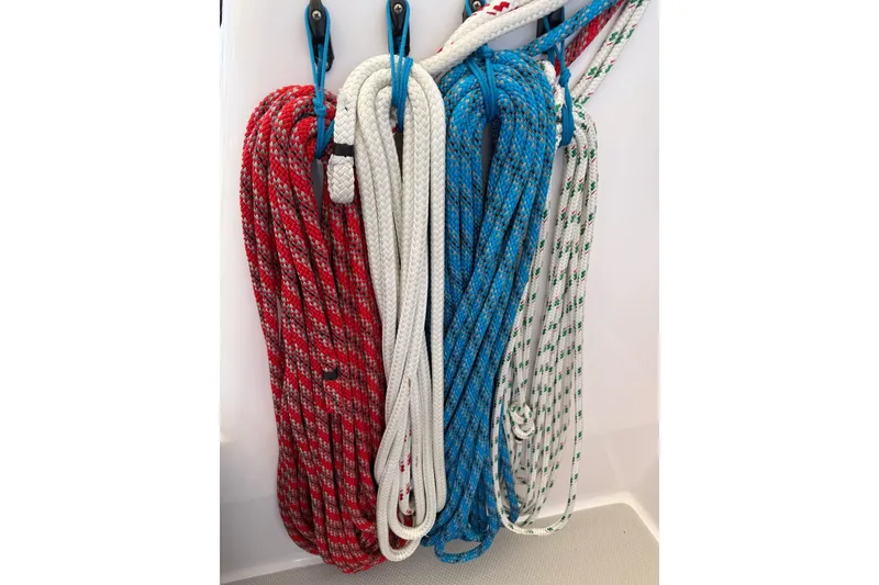 Slide: The Image of Colorful sailing ropes on a 2015 Catalina 445 boat, neatly organized and secured. - 30