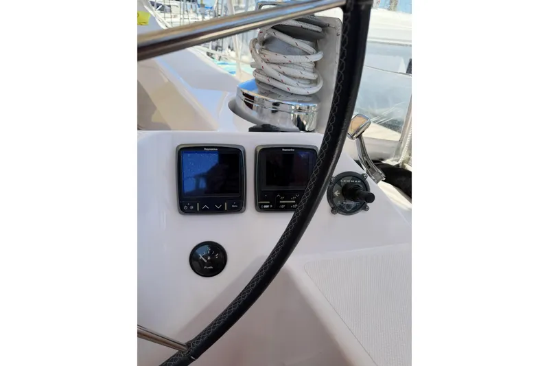 Slide: The Image of Cockpit of 2015 Catalina 445 sailboat with navigation instruments and steering wheel. - 11