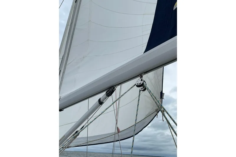 Slide: The Image of Sailing on a 2015 Catalina 445 yacht with sails unfurled against a cloudy sky. - 3