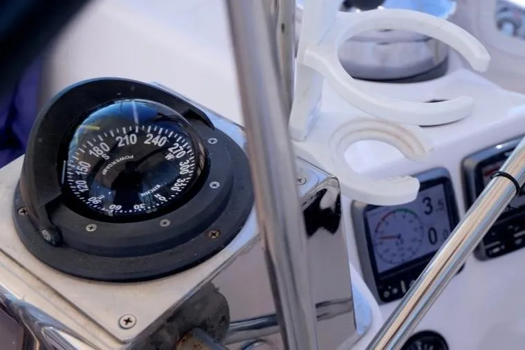 Slide: The Image of Compass and instruments on a 2015 Catalina 445 sailboat cockpit. - 12