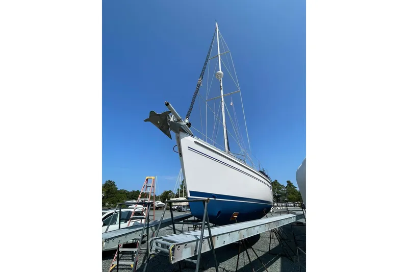 Slide: The Image of 2015 Catalina 445 sailboat on dry dock under clear blue sky. - 6