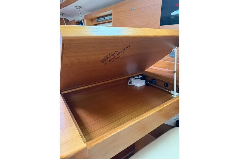 Slide: The Image of Open wooden storage compartment in a 2015 Catalina 445 sailboat interior. - 47