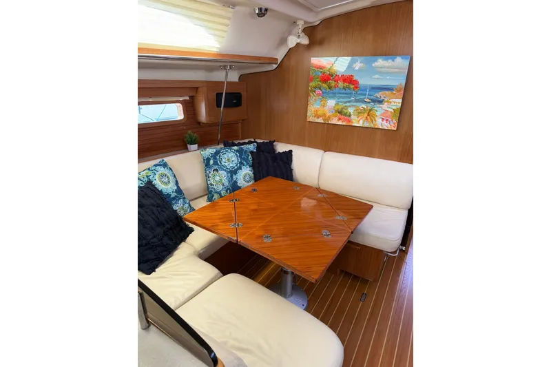 Slide: The Image of Interior of 2015 Catalina 445 yacht with cozy seating and decorative pillows. - 50