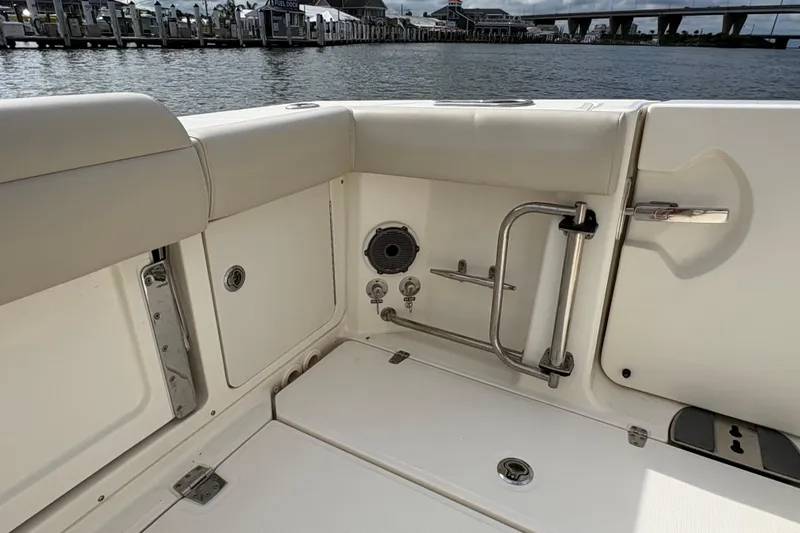 Slide: The Image of Interior view of a 2020 Boston Whaler 330 Outrage boat, featuring seating and storage. - 21