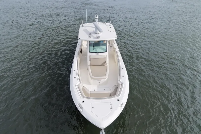 Slide: The Image of 2020 Boston Whaler 330 Outrage boat on calm water, aerial view. - 2