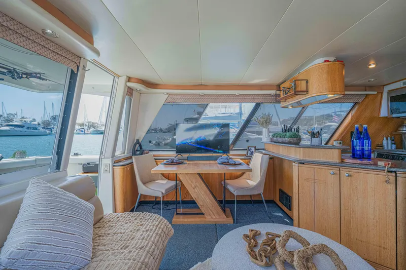 Slide: The Image of Luxurious interior of a 1998 Bayliner 4788 Pilot House Motoryacht with elegant dining area. - 5