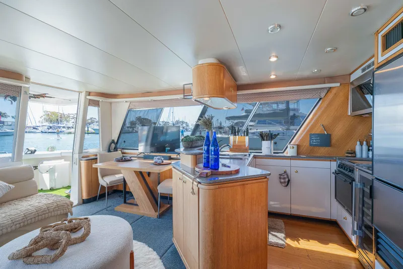Slide: The Image of Luxurious interior of 1998 Bayliner 4788 Pilot House Motoryacht with modern kitchen and scenic views. - 8