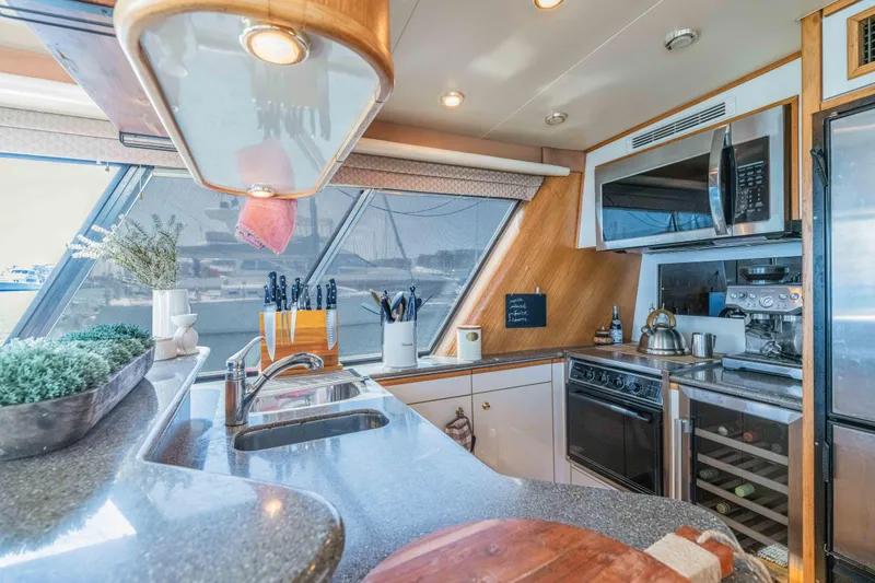 Slide: The Image of Luxurious kitchen interior of 1998 Bayliner 4788 Pilot House Motoryacht with modern appliances. - 12
