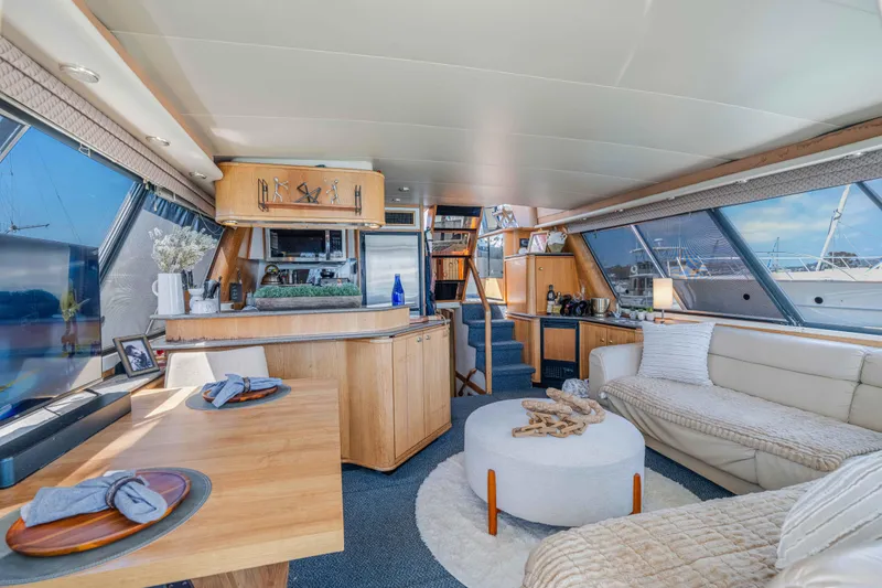 Slide: The Image of Luxurious interior of a 1998 Bayliner 4788 Pilot House Motoryacht with modern furnishings. - 4