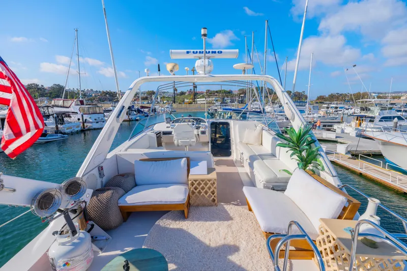 Slide: The Image of Luxurious 1998 Bayliner 4788 Pilot House Motoryacht with spacious deck and marina view. - 31