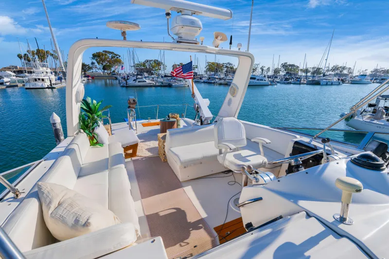 Slide: The Image of Luxurious 1998 Bayliner 4788 Pilot House Motoryacht docked in a scenic marina. - 36
