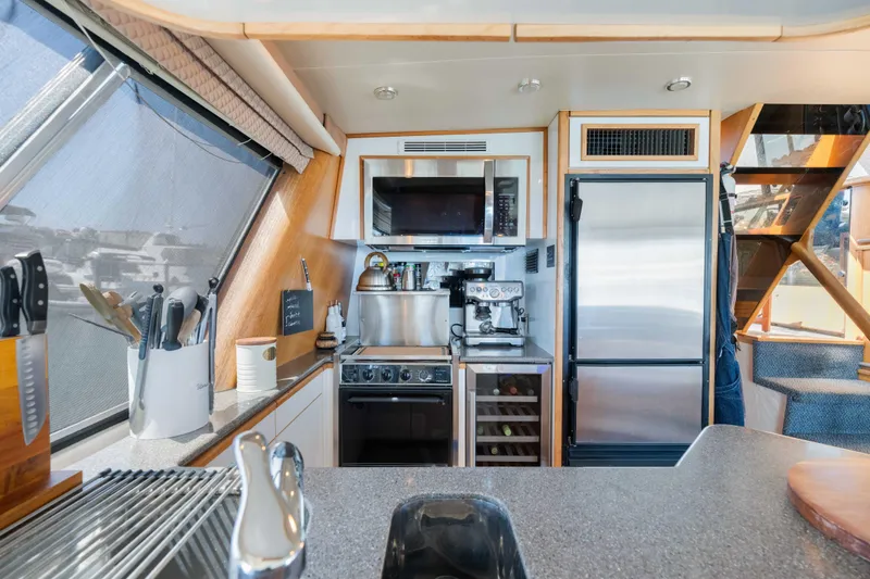 Slide: The Image of Modern kitchen interior of 1998 Bayliner 4788 Pilot House Motoryacht with appliances and utensils. - 10