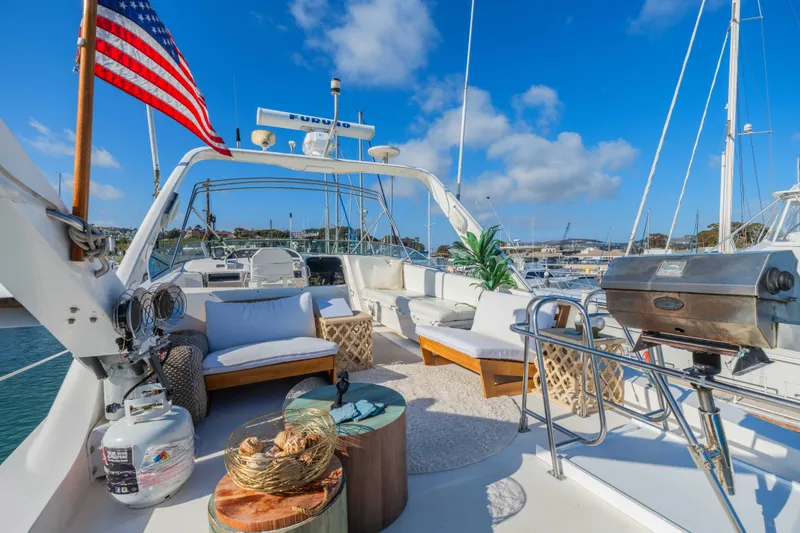 Slide: The Image of Luxurious 1998 Bayliner 4788 Pilot House Motoryacht deck with seating and grill. - 32