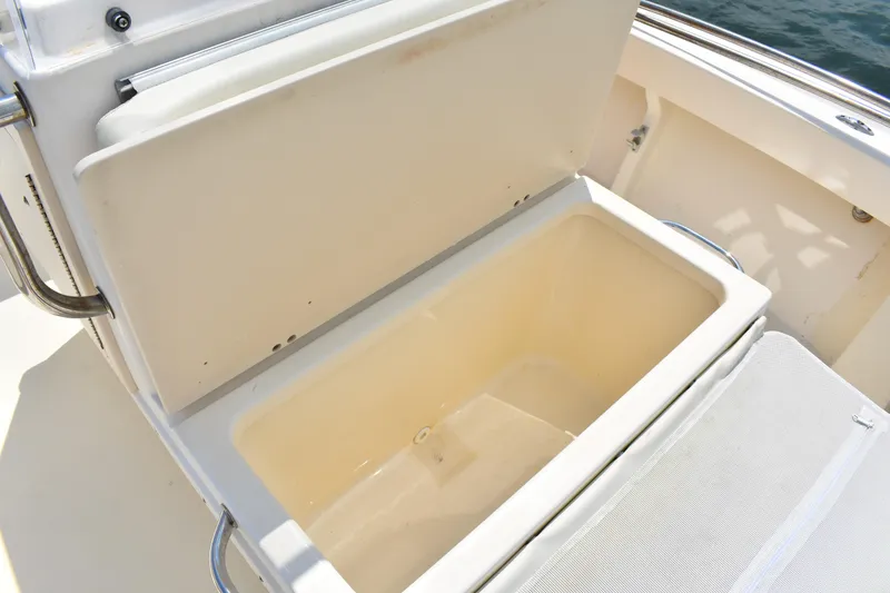 Slide: The Image of Open storage compartment on a 2005 Parker 1801 Center Console boat. - 10