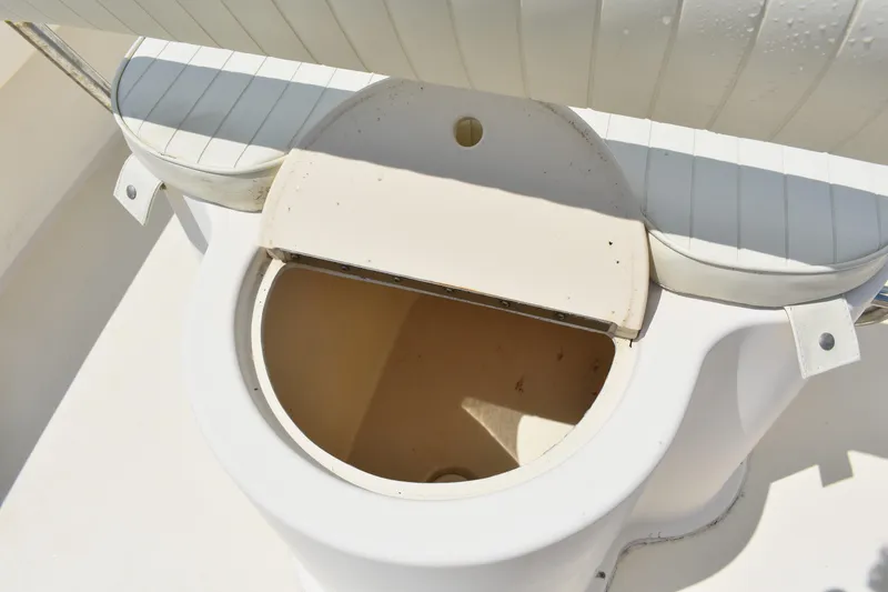 Slide: The Image of 2005 Parker 1801 Center Console boat seat with storage compartment open. - 13