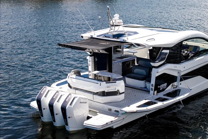 Slide: The Image of Galeon 435 GTO 2027: Sleek motorboat with three outboard engines, spacious deck, and modern design. - 8