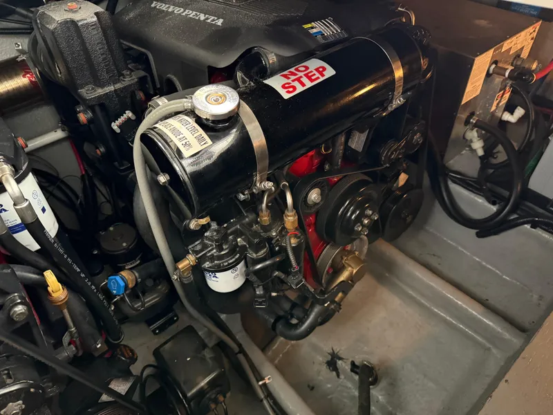 Slide: The Image of Engine compartment of a 2003 Monterey 302 Cruiser with visible components and "No Step" label. - 43
