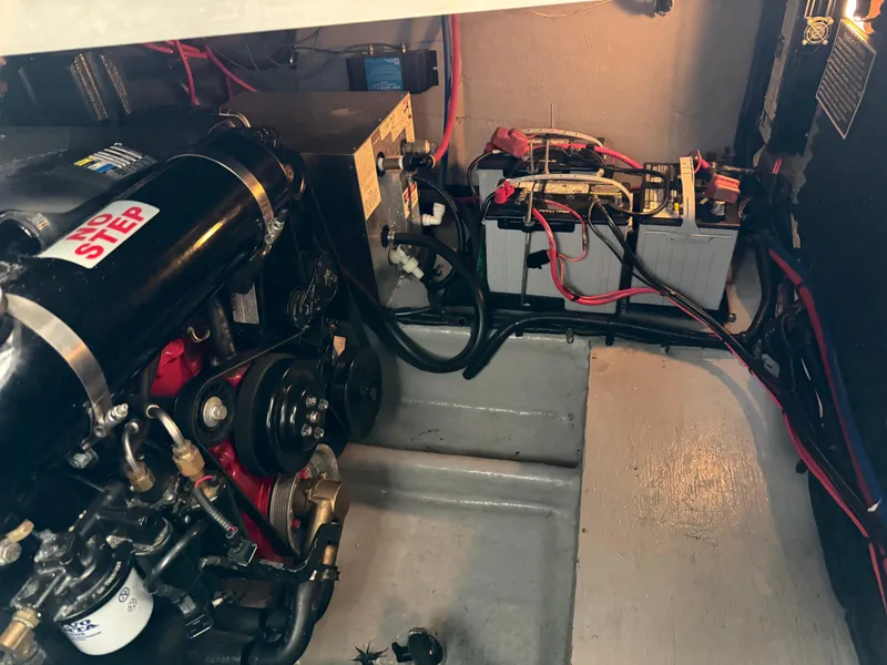Slide: The Image of Engine compartment of a 2003 Monterey 302 Cruiser with visible wiring and components. - 44