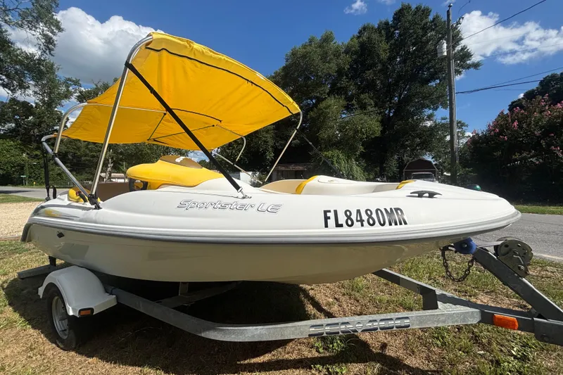 The Image of 2004 Sea-Doo Sportster LE DI boat with yellow canopy on trailer. - 0