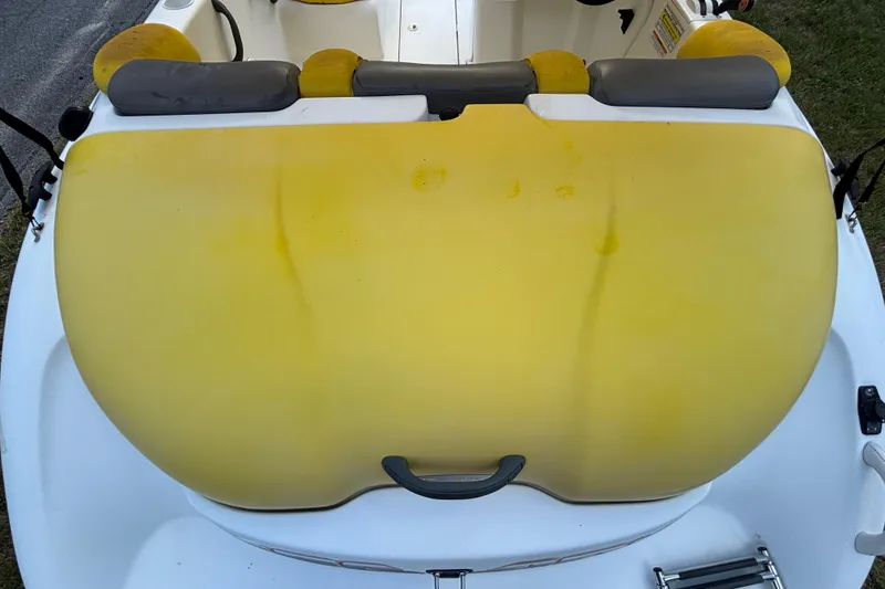 Slide: The Image of 2004 Sea-Doo Sportster LE DI boat with yellow seating and white deck. - 11