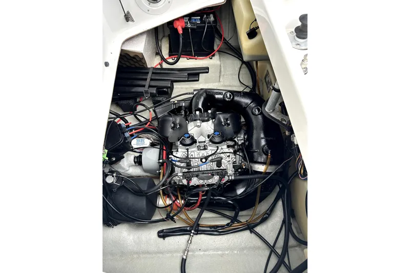 Slide: The Image of 2004 Sea-Doo Sportster LE DI engine compartment with visible wiring and components. - 8
