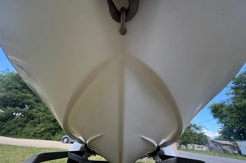Slide: The Image of 2004 Sea-Doo Sportster LE DI boat hull, close-up view, outdoors. - 10