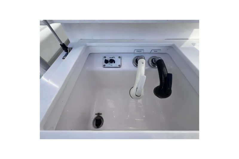 Slide: The Image of Boat sink with dual faucets on a 2020 Southport 33 FE model. - 29