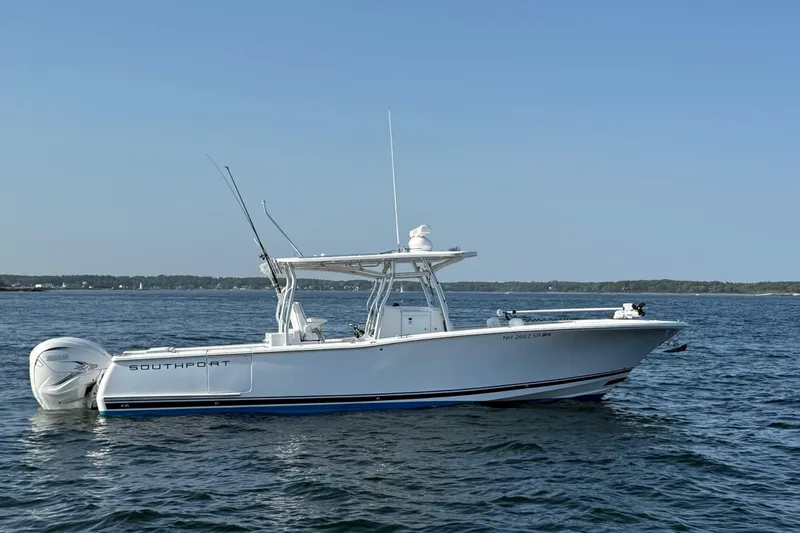 Slide: The Image of 2020 Southport 33 FE boat on calm water, side view. - 7