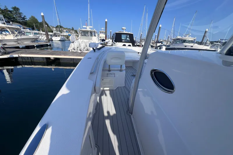 Slide: The Image of 2020 Southport 33 FE boat docked at marina with clear blue sky. - 32