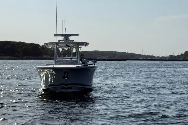 Slide: The Image of 2020 Southport 33 FE boat on calm water with distant shoreline. - 2