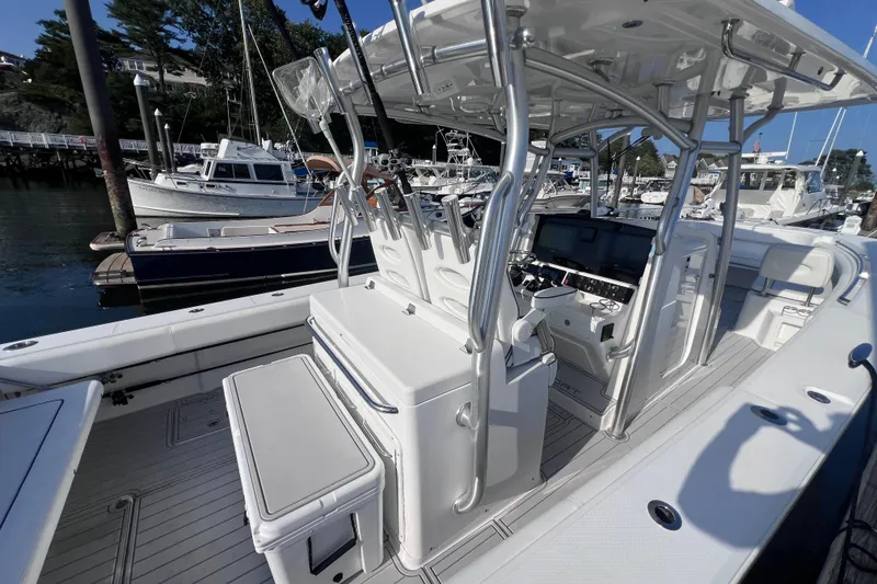 Slide: The Image of 2020 Southport 33 FE boat interior with helm station and seating at marina. - 36