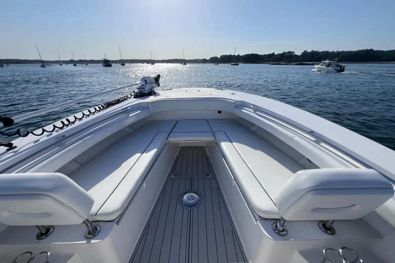 Slide: The Image of 2020 Southport 33 FE boat on calm water, featuring spacious seating and sleek design. - 22