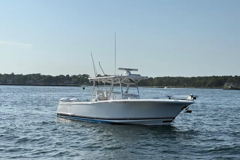 Slide: The Image of 2020 Southport 33 FE boat on calm water with distant shoreline. - 3
