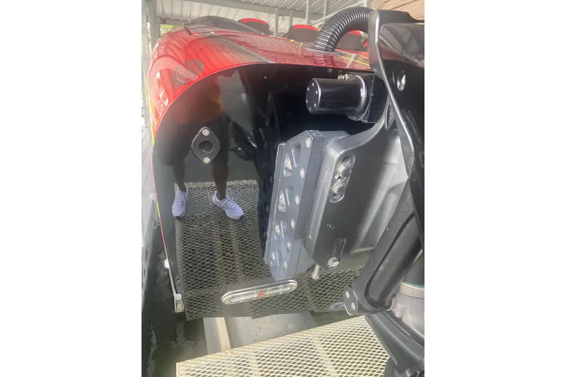 Slide: The Image of Close-up of a 2021 Doug Wright P360 boat's rear section with visible hardware. - 14