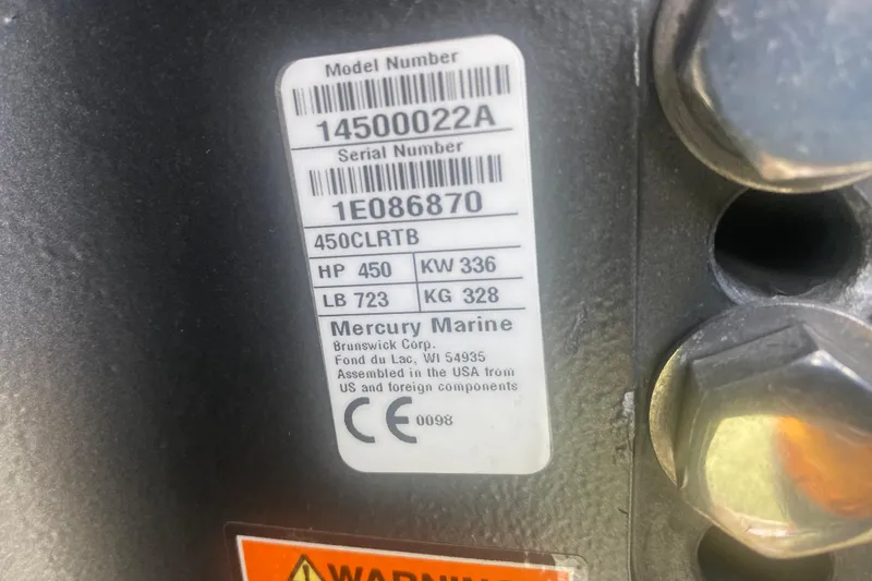 Slide: The Image of Label on Mercury Marine engine showing model, serial number, and specifications. - 23