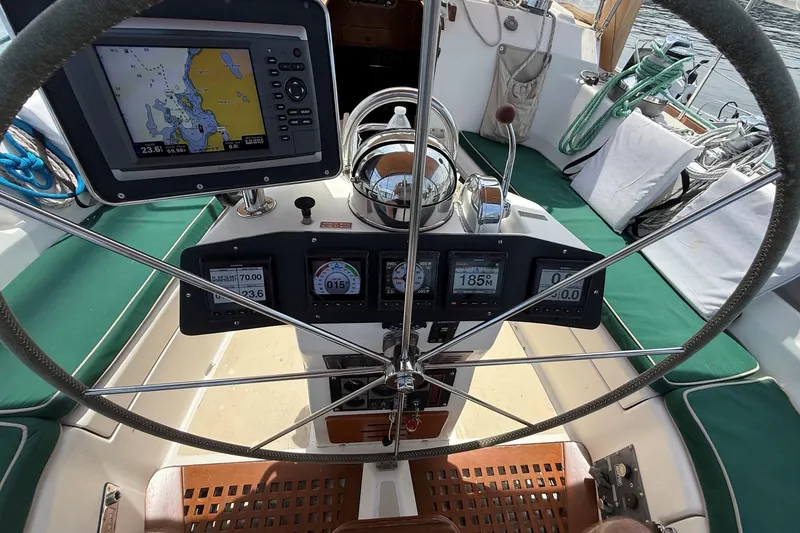 Slide: The Image of Cockpit of 1993 Tartan 4600 sailboat with navigation instruments and steering wheel. - 14