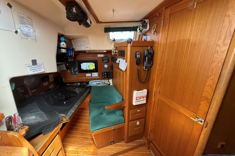 Slide: The Image of Interior of a 1993 Tartan 4600 sailboat with navigation equipment and wooden cabinetry. - 20