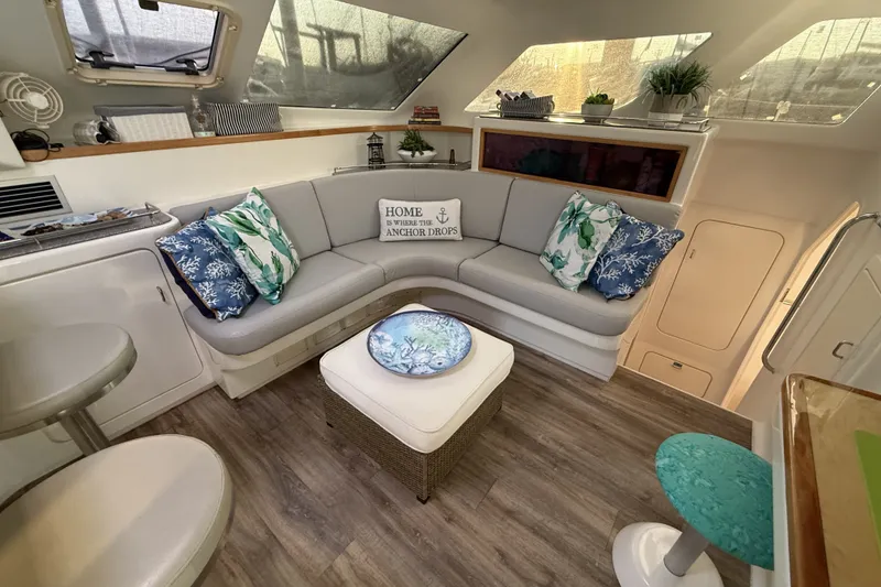 Slide: The Image of Cozy interior of 2002 Voyage 440 yacht with stylish seating and nautical decor. - 18