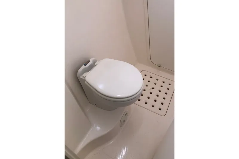 Slide: The Image of Compact marine toilet in a 2002 Voyage 440 yacht bathroom. - 41