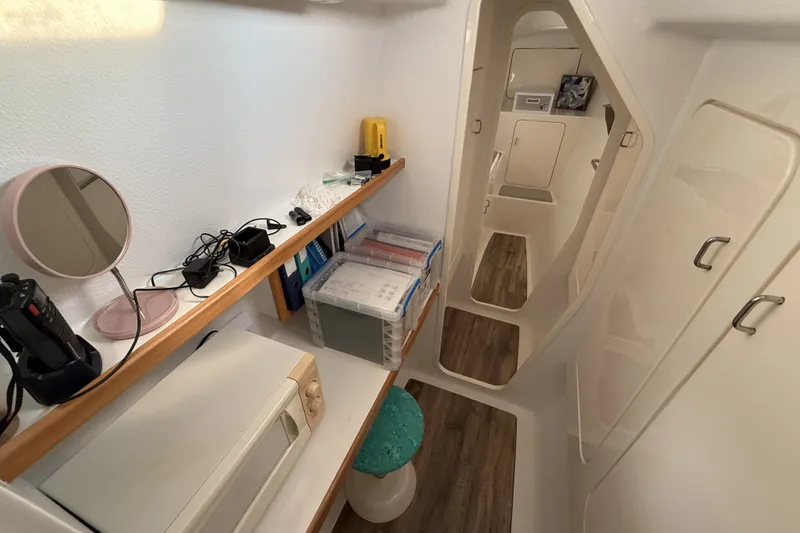 Slide: The Image of Interior of a 2002 Voyage 440 yacht with organized shelves and modern amenities. - 21
