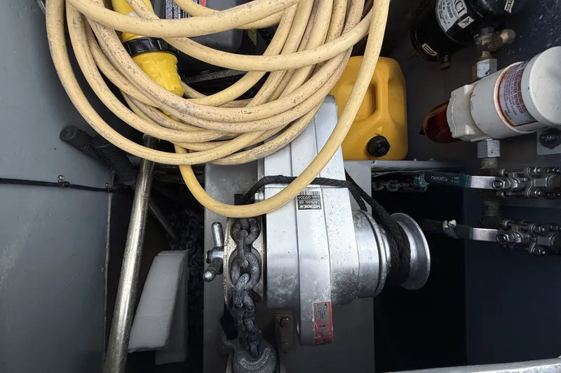Slide: The Image of Storage compartment of a 2002 Voyage 440 yacht with cables and equipment. - 40