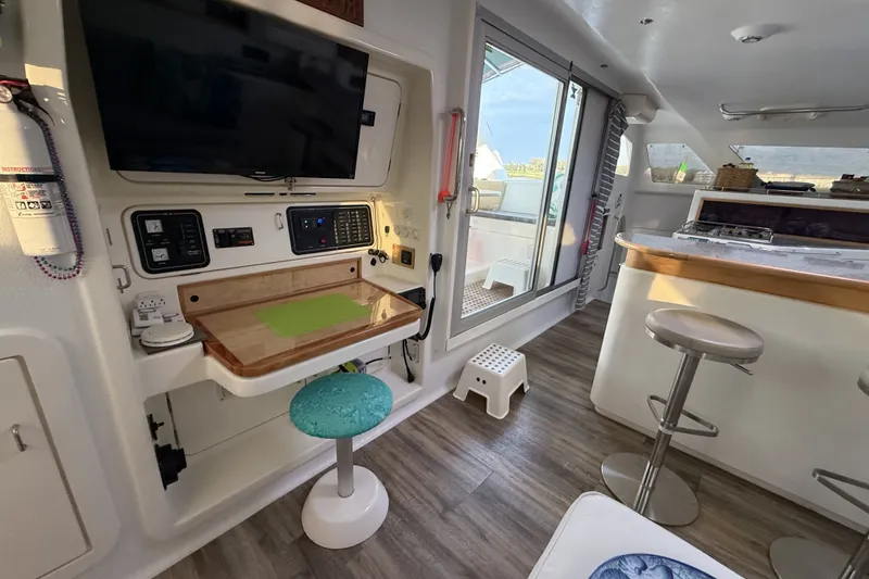 Slide: The Image of Interior of 2002 Voyage 440 yacht with modern amenities and sleek design. - 16