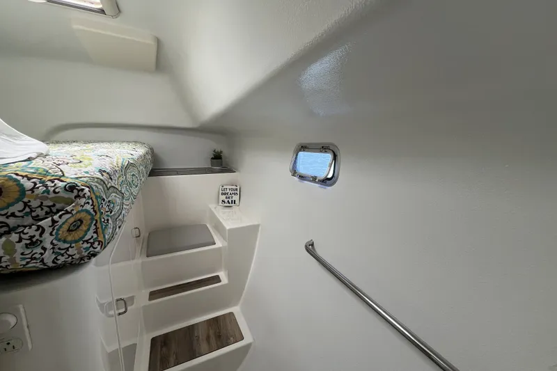 Slide: The Image of Interior of 2002 Voyage 440 yacht with cozy bed and decorative stairs. - 31